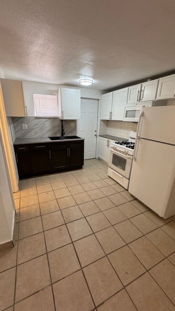 Upgraded 2 bedroom 1 bathroom Huge backyard Private parking 1 of 8