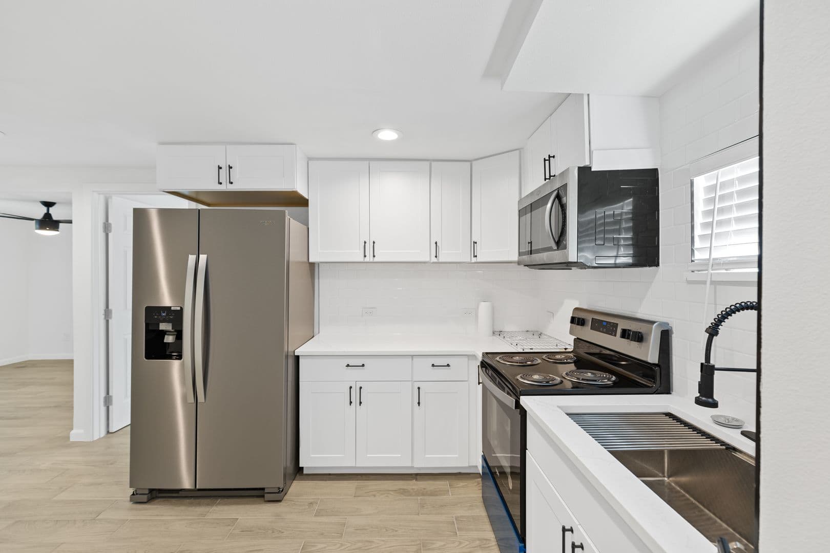 Updated 3 Bed / 2 Bath Two-Level Home with Granite Counters and Fenced Yard in 1 of 16